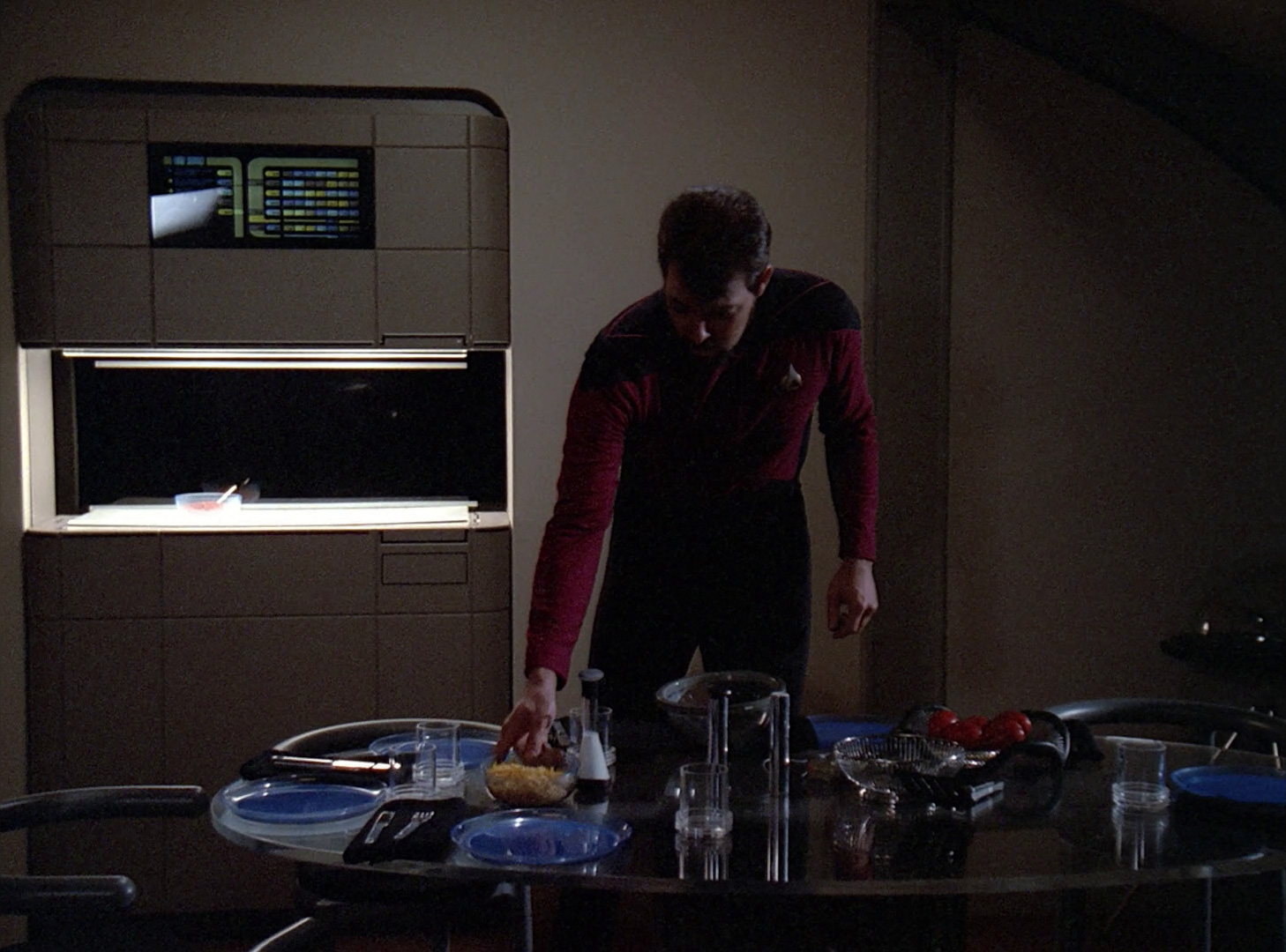 Commander Riker prepares a meal in his quarters, the Replicator can be seen in the background